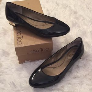 Black patent leather flats with gold heel